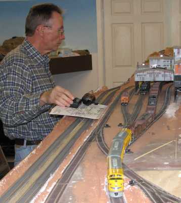 Roger Macauley backs in a coal drag during an operating session on APN